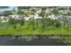 Aerial view of a community with large lots, mature trees, and lakefront properties at 9827 Sorbonne Loop, Seffner, FL 33584