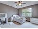 Cozy bedroom with carpet, a modern vanity, ample natural light, and a comfortable bed at 9827 Sorbonne Loop, Seffner, FL 33584