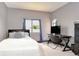 This bedroom features carpet, a bed, a desk, and a large window at 9827 Sorbonne Loop, Seffner, FL 33584