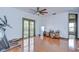 This bonus room offers hardwood floors, natural light, and workout equipment at 9827 Sorbonne Loop, Seffner, FL 33584