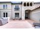 Home exterior features brick driveway, neutral paint, and outdoor seating, creating a cozy and inviting entrance at 9827 Sorbonne Loop, Seffner, FL 33584