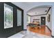 Elegant foyer with decorative glass front doors and archway leading into the dining area at 9827 Sorbonne Loop, Seffner, FL 33584