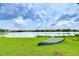 Backyard with canoe by the lake at 9827 Sorbonne Loop, Seffner, FL 33584