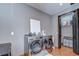 Modern laundry room with sleek washer, dryer, storage and convenient access to closet at 9827 Sorbonne Loop, Seffner, FL 33584