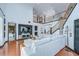 Spacious living area with a two-story staircase and modern decor, creating an airy and elegant atmosphere at 9827 Sorbonne Loop, Seffner, FL 33584