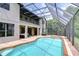 Large pool and outdoor entertainment area with screened enclosure at 9827 Sorbonne Loop, Seffner, FL 33584