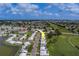 Community aerial view showcasing the neighborhood, landscaping, and nearby golf course at 10005 41St N St, Pinellas Park, FL 33782