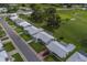 Aerial shot showcasing the neighborhood's layout, green spaces, and proximity to a golf course at 10005 41St N St, Pinellas Park, FL 33782