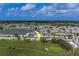 Enjoy a scenic aerial view of the neighborhood with easy access to a golf course and a lake at 10005 41St N St, Pinellas Park, FL 33782