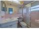 Retro bathroom with pink tile, shower, sink, and vanity at 10005 41St N St, Pinellas Park, FL 33782