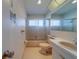 Bathroom featuring pink tiles, shower, sink, and vanity at 10005 41St N St, Pinellas Park, FL 33782