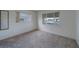 Bedroom featuring neutral carpet, light walls and bright windows at 10005 41St N St, Pinellas Park, FL 33782