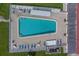 Aerial view of the community pool with lounge chairs and tables at 10005 41St N St, Pinellas Park, FL 33782
