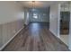 Open-concept dining room with gray floors and bead board trim, adjacent to kitchen at 10005 41St N St, Pinellas Park, FL 33782