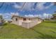 Beautiful exterior of home, with lawn and unique front patio at 10005 41St N St, Pinellas Park, FL 33782
