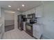 Well-lit kitchen featuring appliances and white cabinets, offering functionality and style at 10005 41St N St, Pinellas Park, FL 33782