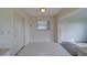 Eat-in kitchen with white tile floors, white cabinetry, and access to the dining room at 10005 41St N St, Pinellas Park, FL 33782