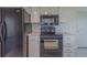 Kitchen featuring white cabinetry and black appliances at 10005 41St N St, Pinellas Park, FL 33782