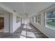 Bright and airy living room featuring gray floors and opening to the kitchen at 10005 41St N St, Pinellas Park, FL 33782