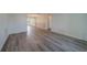Spacious living room featuring modern wood-look flooring, neutral walls, and natural light, creating a comfortable atmosphere at 10005 41St N St, Pinellas Park, FL 33782