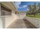 Concrete patio area with a white decorative wall offers a nice outdoor space at 10005 41St N St, Pinellas Park, FL 33782