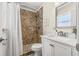 Bright bathroom featuring a single sink vanity with an updated shower at 10339 111Th St, Largo, FL 33778