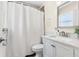 Bright bathroom featuring a single sink vanity with a shower tub combo at 10339 111Th St, Largo, FL 33778