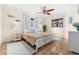 Inviting bedroom features white wood furnishings, two windows, with modern decor creating a relaxing atmosphere at 10339 111Th St, Largo, FL 33778