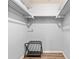 A walk-in closet featuring an organization system and hardwood floors at 10339 111Th St, Largo, FL 33778