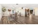 Open dining area with wood floors, stylish decor, and seamless flow to other living spaces at 10339 111Th St, Largo, FL 33778