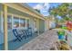 Inviting front porch with seating and a neatly paved walkway to the entrance at 10339 111Th St, Largo, FL 33778
