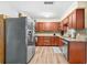 Spacious kitchen features stainless steel appliances, wood cabinets, granite counters, and bright lighting at 10339 111Th St, Largo, FL 33778