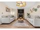 Comfortable living room featuring a stone fireplace, plush seating, and modern décor at 10339 111Th St, Largo, FL 33778
