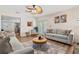 Inviting living room with stylish furnishings, natural light, and easy access to the kitchen at 10339 111Th St, Largo, FL 33778