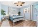 Serene bedroom with light blue walls, hardwood floors, and ample natural light at 10339 111Th St, Largo, FL 33778