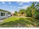 The large grassy backyard provides ample space for outdoor activities and relaxation at 11775 84Th Ave, Seminole, FL 33772