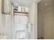 Compact bathroom featuring sleek fixtures, practical shelving, and modern design for a functional space at 11775 84Th Ave, Seminole, FL 33772