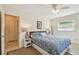 Bedroom with neutral tones, fan, and natural light from a large window at 11775 84Th Ave, Seminole, FL 33772