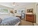 Cozy bedroom featuring neutral walls, fan, and natural light from windows at 11775 84Th Ave, Seminole, FL 33772
