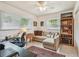 Bedroom area with natural light, a comfortable seating area and workspace at 11775 84Th Ave, Seminole, FL 33772