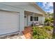 Charming front porch with a bench and unique tile flooring at 11775 84Th Ave, Seminole, FL 33772