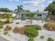 Beautifully landscaped front yard with tropical plants, rock beds, and a cozy sitting area at 11775 84Th Ave, Seminole, FL 33772