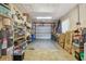 Spacious garage with ample storage on shelves, providing secure parking and extra space for belongings at 11775 84Th Ave, Seminole, FL 33772