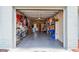 Open garage space featuring organized storage and bike racks, providing functional parking and hobby area at 11775 84Th Ave, Seminole, FL 33772