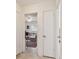Hallway showcasing a glimpse into adjacent rooms with terrazzo flooring at 11775 84Th Ave, Seminole, FL 33772