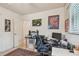 Well-lit home office featuring neutral decor, a comfortable chair, and functional setup at 11775 84Th Ave, Seminole, FL 33772