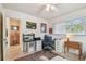 Bright home office with two work stations, ample lighting, and comfortable decor at 11775 84Th Ave, Seminole, FL 33772