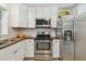 Bright kitchen features stainless appliances, wood countertops, and a range hood at 11775 84Th Ave, Seminole, FL 33772