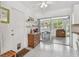 Bright eat-in kitchen features an inviting dining area and access to the outdoors through sliding glass doors at 11775 84Th Ave, Seminole, FL 33772