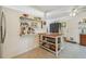 Charming kitchen with open shelving, butcher block island, and a convenient pet door at 11775 84Th Ave, Seminole, FL 33772